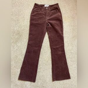 Flared maroon jeans. Low wasted and tight around the butt and flared boots.